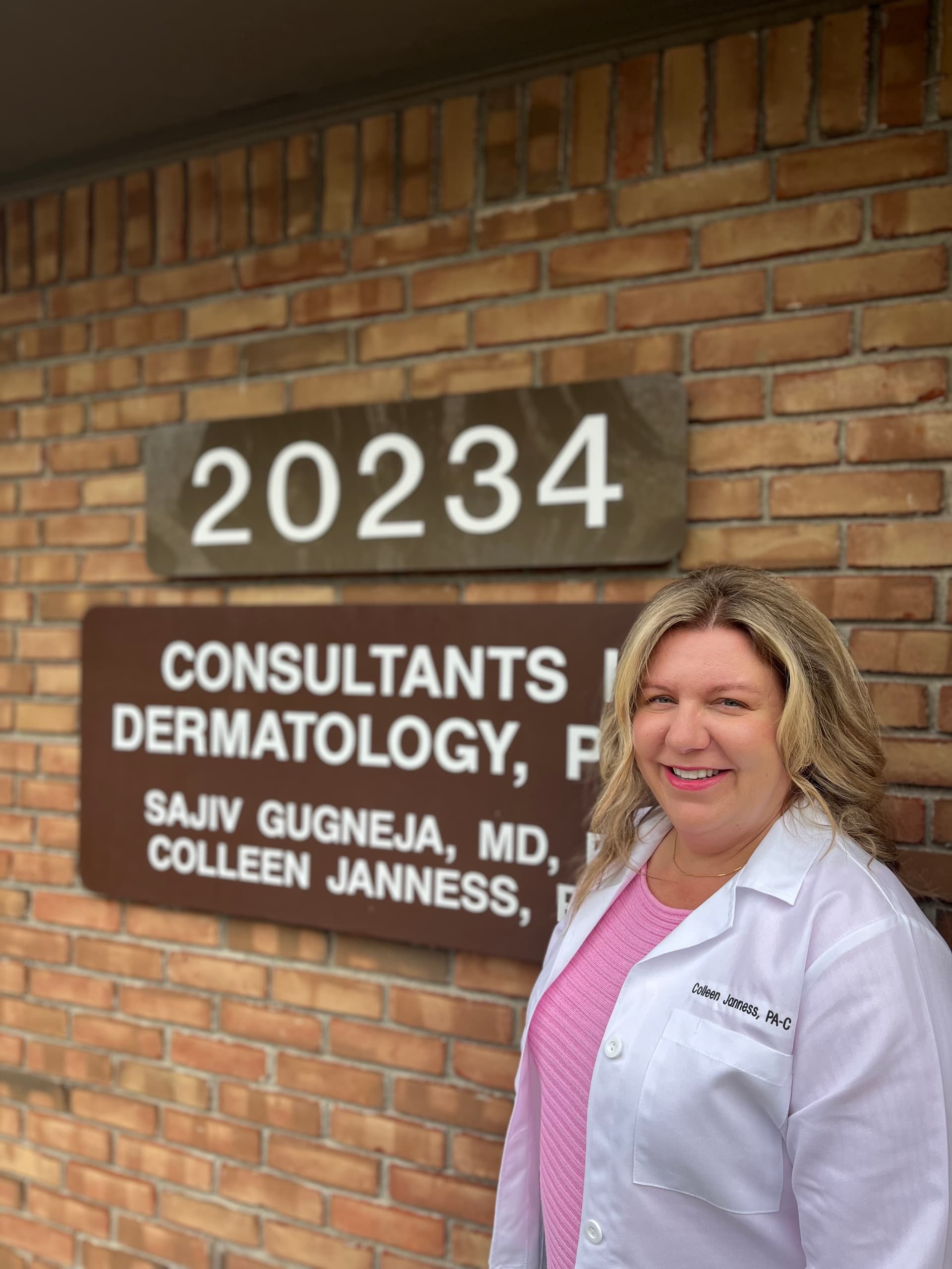 Colleen Janness, PA-C, outside the Consultants in Dermatology office in Livonia, MI